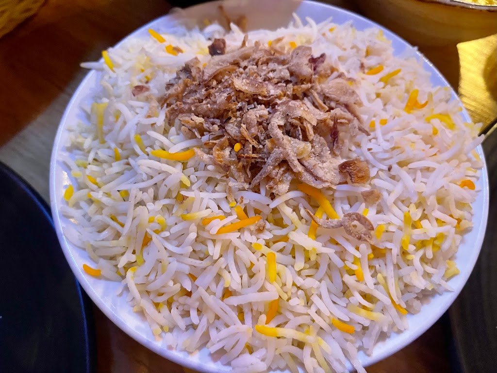 Grace of India biryani plate with fried onions