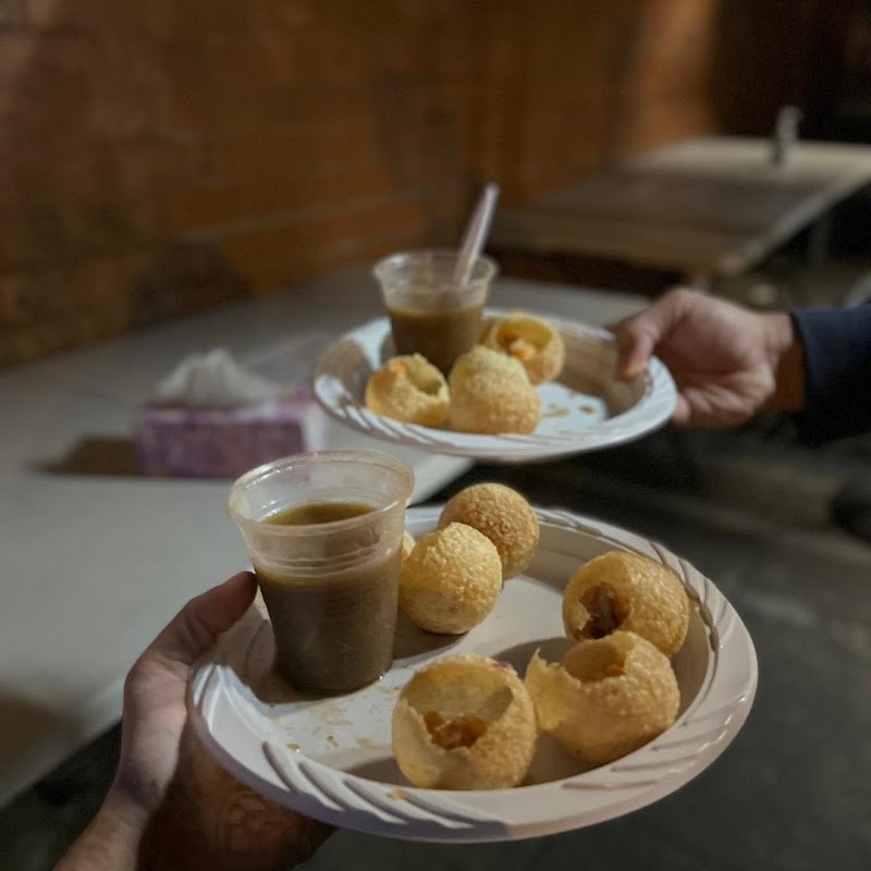 Pani puri plate at 9 Flavours of Panipuri Harris Park with tamarind and mint water cups