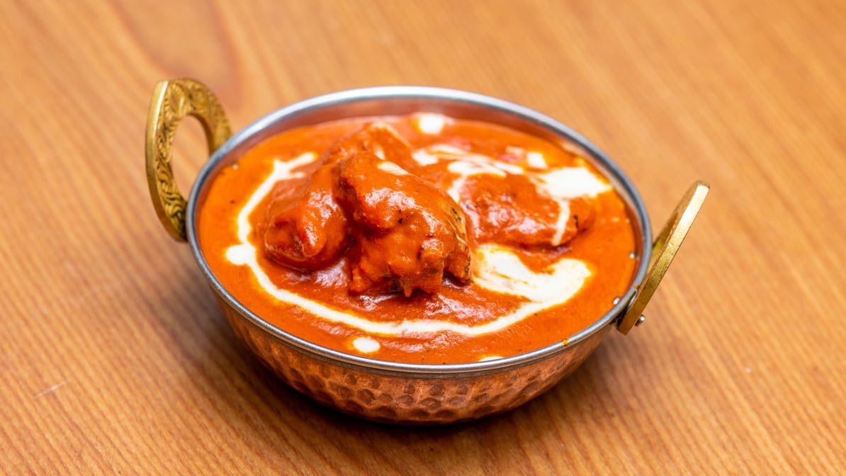 Curry By the Curve butter chicken in a copper karahi