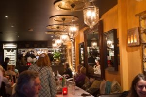 Jewel on the Bay Rose Bay warm dining room interior with guests seated at tables