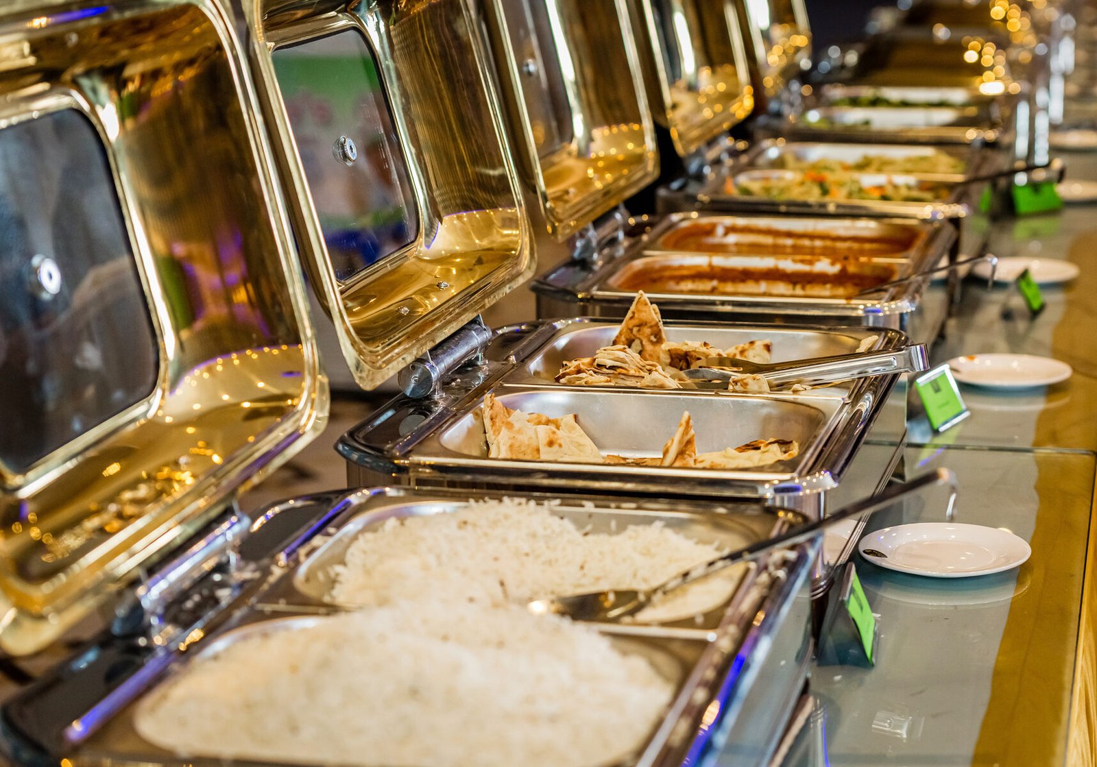 New Yatra Catering buffet chafing dishes with naan, rice and curries set up for a Sydney event