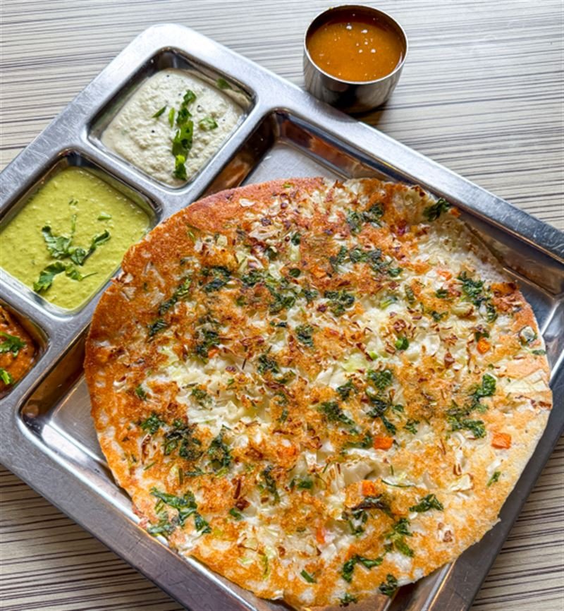Saravanaa Bhavan Parramatta uttapam topped with onion and coriander with sambar and chutneys